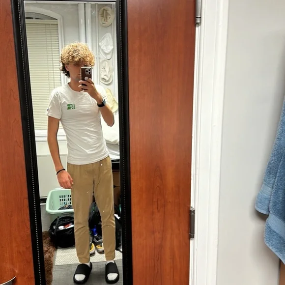 The brand is Russell and the size is small and is white with green and blue. - Picture 5 of 6